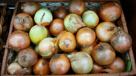 Onion was placed in a wooden basket weave.の写真素材