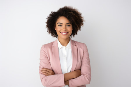 Portrait of smiling african american businesswoman with folded armsの素材