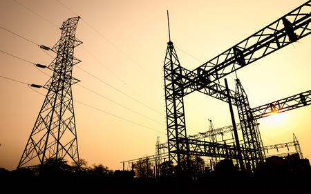 The silhouette of high voltage substation with an evening sky as a background