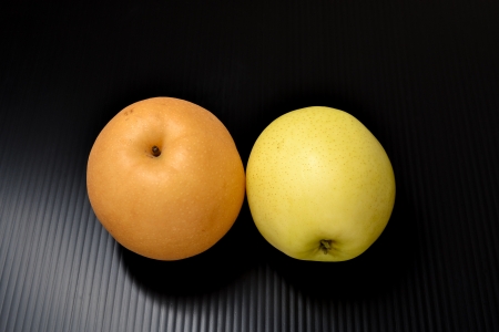 Asian pears on black backgroundの写真素材