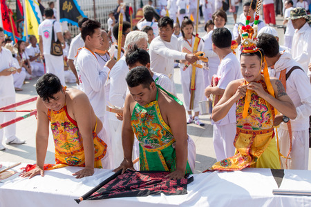 Nakhon Ratchasima, THAILAND - OCT 16 : An unidentified devotee of Vegetarian Festival, person who invites the spirits of gods to possess their bodies on October 16, 2015 in Nakhon Ratchasima, Thailandのeditorial素材