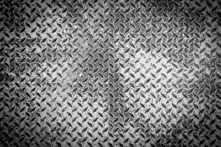 A rusty metal diamond plate texture.の写真素材