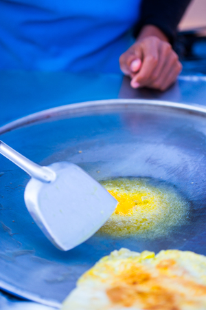 Roti frying in the pan.の写真素材