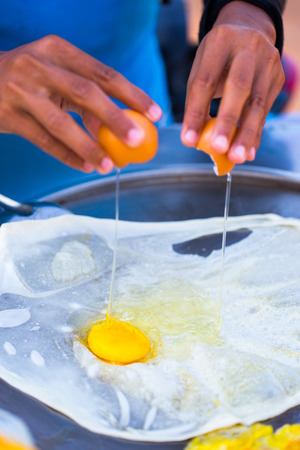 Roti frying in the pan.の写真素材