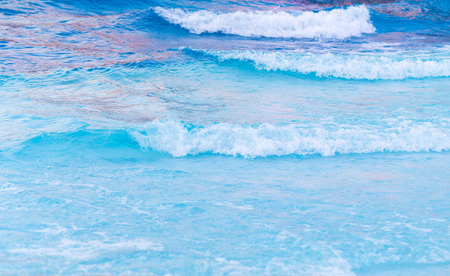 Blue wave on a beachの写真素材