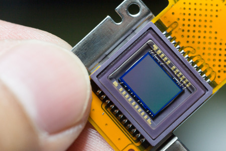 image sensors from the  digital camera in worker hand.の写真素材