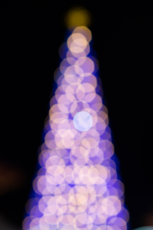 bokeh on christmas tree at nightlightの写真素材