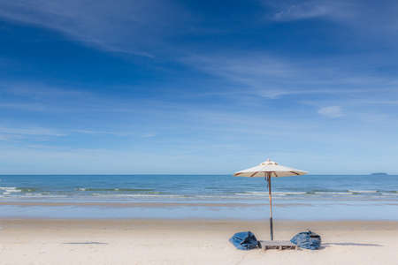 Chair umbrella and lounge on the beautiful beach