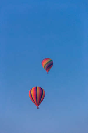 Two Hot Air Balloons against blue skyの写真素材