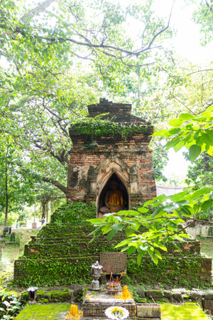 Ancient stupa in Thailand covered with moss.の写真素材