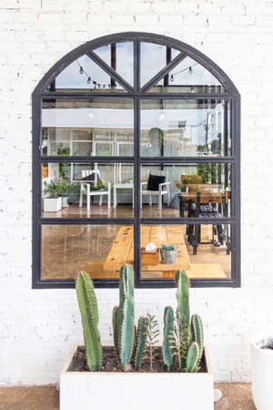 Window with plant box in brick wall