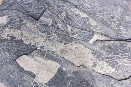 Cracked and weathered natural stone background.