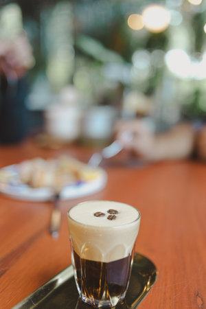 cup of coffee on brown wooden table
