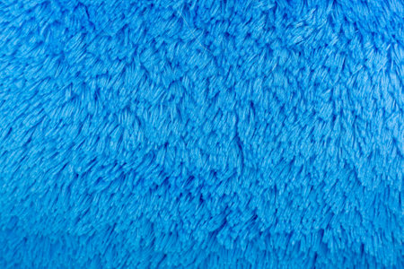 close up of blue terry towel texture for background, wallpaper.