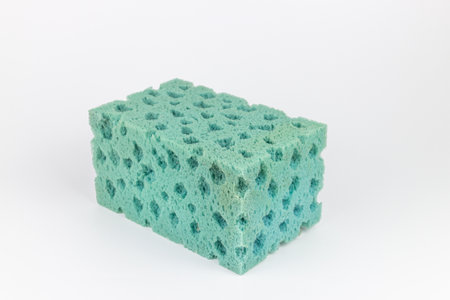 Sponge for washing dishes on a white background, close-upの写真素材