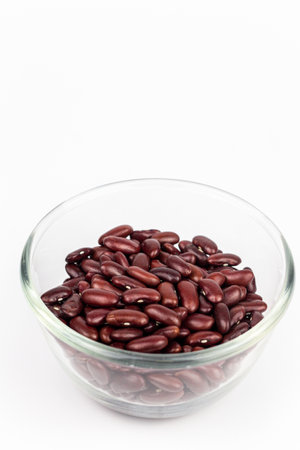 Red kidney beans in glass bowl isolated on white background with clipping pathの写真素材