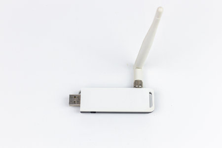 White usb flash drive isolated on white background. Close up. Selective focus.