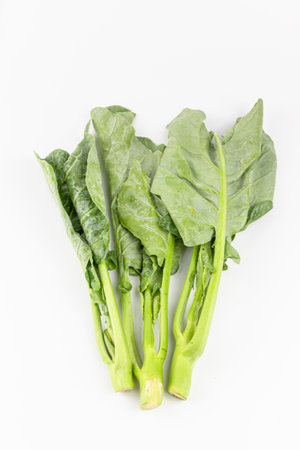 Chinese kale vegetable on white background, closeup of green vegetable.
