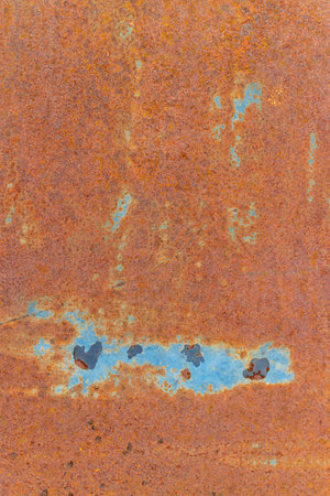 rusty corrugated iron sheet with blue peeling paint background