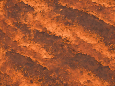 abstract orange background texture with some smooth lines and spots in itの素材