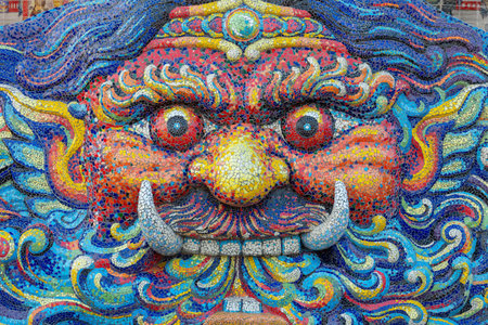 Giant statue decorated with colorful mosaic tiles at Wat Ban Rai, Nakhon Ratchasima Province, Thailand.の写真素材