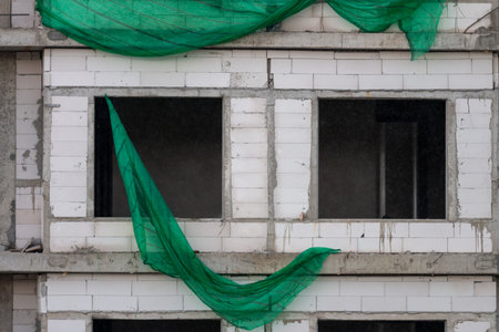 Construction of a building with windows being madeの写真素材