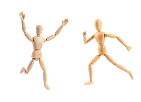 Wooden mannequin running isolated over the white background, set of two different foreshorteningsの素材