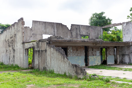 Abandoned stone and wooden building with old fence in the landscapeの写真素材