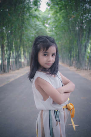 Happy cute little girl in parkの写真素材