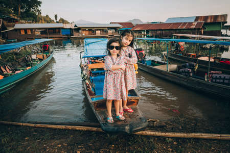 Two children going in the pierの写真素材