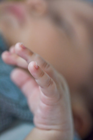 baby's hand close-up on a blurred background of a child