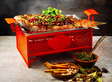 signature saba fish in a dish isolated on stew on mat side view on grey backgroundの写真素材