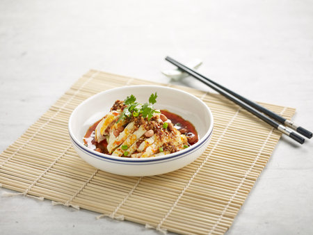 signature fish with Mushroom Herbs in a dish isolated on stew on mat side view on grey backgroundの写真素材