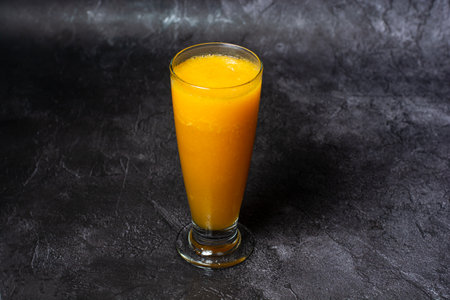 Papaya Juice served in glass isolated on grey background top view of indian and bangladesh foodの写真素材