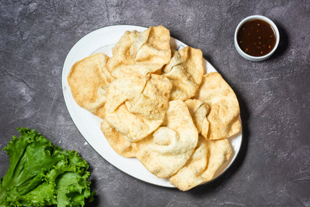 fried Wonton or woonthon and sauce served in dish isolated on grey background top view of indian and...