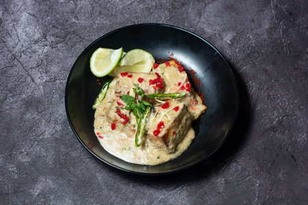 Navratan Korma with lime served in dish isolated on grey background top view of indian and bangladesh foodの写真素材