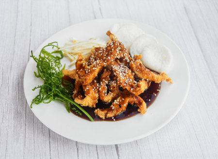 Chiken Teriyaki served in dish isolated on grey wooden background side view of fastfoodの写真素材
