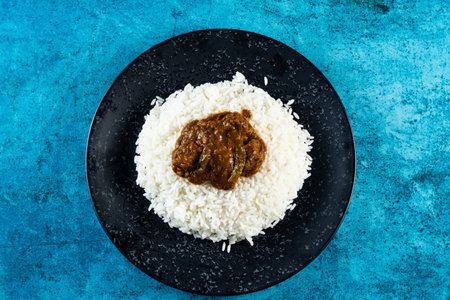 Plain boiled rice with pickle in a plate top view on marble backgroundの写真素材