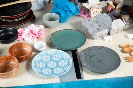 Close up view of a kitchen table with different ceramic utensilsの写真素材
