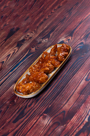 crispy chicken wings with ketchup and mayo dip served in dish isolated on background top viewの写真素材