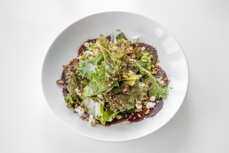 Beets Goat Cheese Salad served in a dish isolated on grey background top viewの写真素材