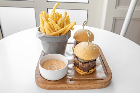 Beed Sliders with french fries and mayo dip served in a dish isolated on grey background top viewの写真素材