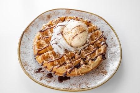Churros Waffle with chocolate served in a dish isolated on grey background top viewの写真素材