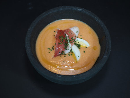 Cold Tomato Soup Spanish Style served in a dish isolated on dark background top viewの写真素材