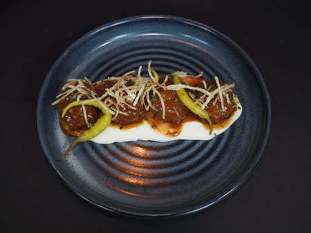 Creamy Beef Meatballs with sauce served in a dish isolated on dark background top viewの写真素材