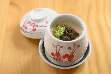 Japanese food Truffle Chawanmushi steamed egg served in a bowl isolated on wooden background top viewの写真素材