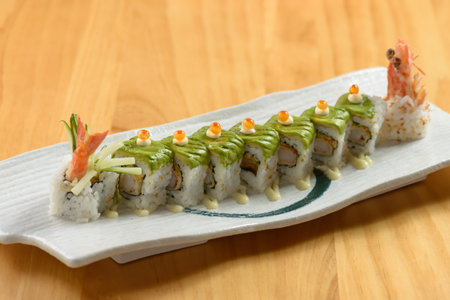 Sushi roll set green Dragon in white tray on wooden background top viewの写真素材