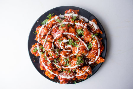 Spicy chicken Maharaja or chicken Moharaza served in a dish isolated on grey background top view of...
