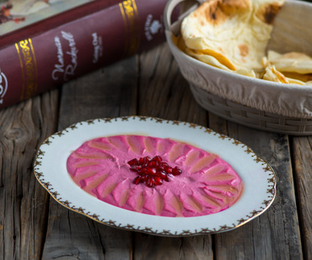 beetroot hummus served in a dish isolated on wooden background side view of appetizerの写真素材