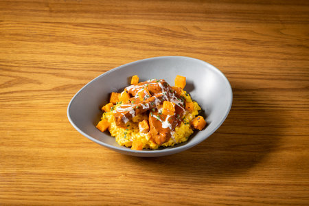 Butternut Squash with Braised Beef Cheek Risotto served in dish isolated on table top view of thai foodの写真素材
